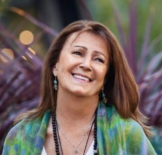 Olivia-Headshot-Flowers-CROP-e1689269319155_743c22e6